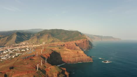 Wild-rugged-shore-at-Ponta-de-São-Lourenço,-Madeira,-green-renewable-energy-facilities,-solar-power,-wind-energy,-aerial