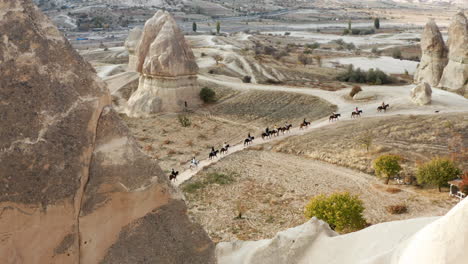 Cappadocia-Horseback-Riding-Experience-With-Fairy-Chimneys-Landscape-In-Turkey