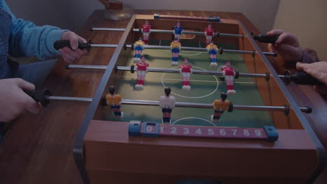 Kids-play-table-football-at-home