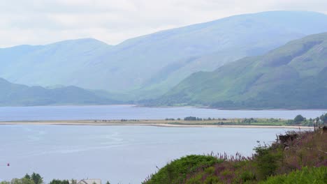 Beautiful-view-over-Ardgour-Beach-in-Loch-Linnhe-amongst-the-hilly-countryside-of-Scotland-on-a-calm-summer-day