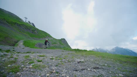 A-cyclist-is-riding-a-high-altitude-trail