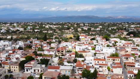 Dolly-zoom-shot-of-Aegina-island-with-buildings-veiw-,-Saronic-Gulf,-Greece