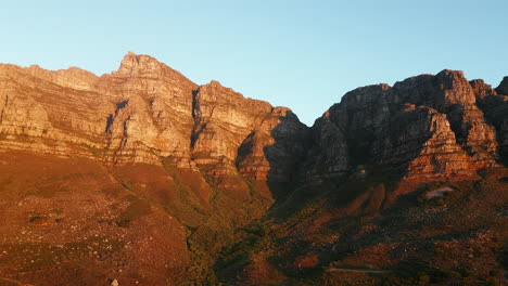 Majestic-Sunset-View-Of-12-Apostles-And-Table-Mountain-National-Park---Panning-Aerial-Shot