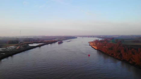 Aerial-Flying-Over-Oude-Maas-Near-Puttershoek-With-Barge-In-Distance