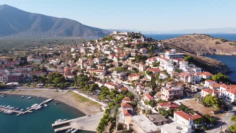 Astros,-Peloponnese,-Greece---Aerial-Drone-View-of-Theater,-Fortress,-Port,-Boats-and-Picturesque-Town-on-the-Mountains