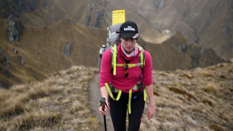 Woman-hiking-through-the-mountains-on-an-epic-adventure