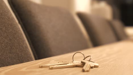 stressed-Hand-places-set-of-house-keys-on-table