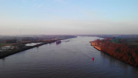 Aerial-Flying-Over-Oude-Maas-Near-Puttershoek-With-Barge-In-Distance