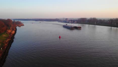 Aerial-Morning-View-Of-Two-Barges-On-Oude-Maas-In-Puttershoek