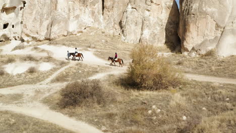 Vacationist-Riding-Horses-In-Goreme-National-Park-At-Summer-In-Cappadocia,-Turkey