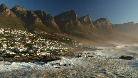 Waves-Break-At-The-Rugged-Shore-Of-Camps-Bay-Beach-In-Cape-Town,-South-Africa