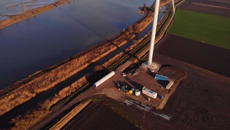 White-Tower-Of-Wind-Turbine-In-Foundation-In-Land-Next-To-Oude-Maas