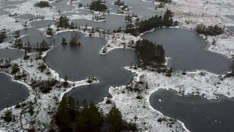 Aerial-drone-view-of-many-frozen-bog-lakes