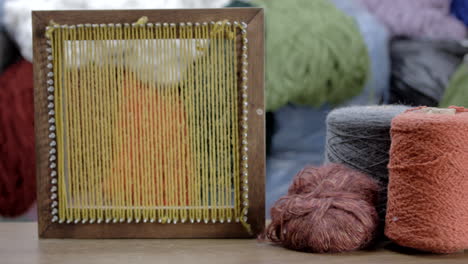 Still-take-of-wool-thread-coils-and-wooden-frame