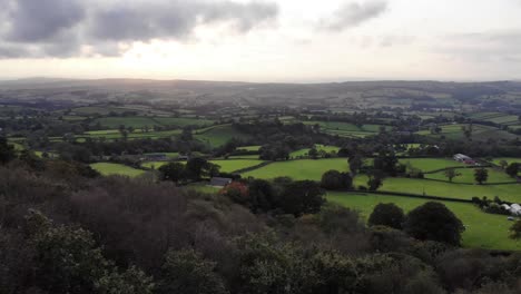 Aerial-Rising-Reveal-Of-Idyllic-Farm-Fields-In-East-Hill-Devon