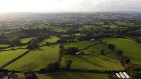 Aerial-Flying-Over-Idyllic-Farm-Fields-In-East-Hill-Devon