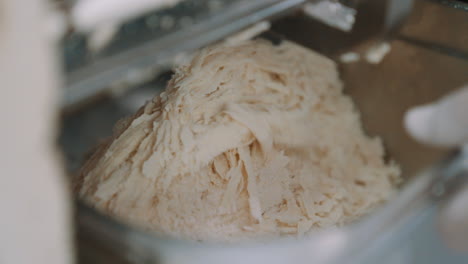 Slow-Motion-of-Finely-Grounded-Almond-Flour-Food-Processor,-Grinding-Almonds-for-Making-Marzipan