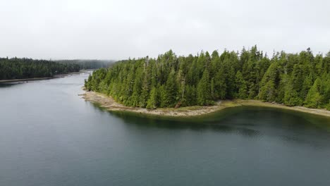 The-west-coast-of-Vancouver-Island-British-Columbia-in-Bamfield-BC,-drone-flying-over-the-ocean-and-forest