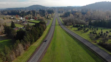Aerial-Shot-of-Traffic-moving-along-highway-26-Eastbound-towards-Mt-Hood,-Oregon-USA