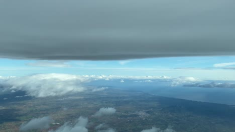 Aerial-view-flying-under-a-flat-cloud-in-Palma-de-Mallorca-in-a-winter-day