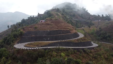 Drone-footage-side-view-of-the-BP-Highway,-Bardibas-Highway,-in-the-hills-and-mountains-of-Nepal