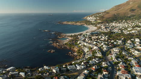 Aerial-View-Of-Bakoven-Rocky-Shore-Near-Camps-Bay-Beach-In-Cape-Town,-South-Africa