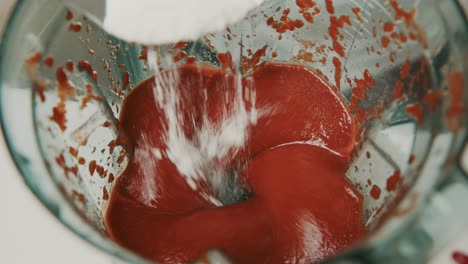 Adding-xanathan-gum-to-ketchup-ingredients-inside-blender