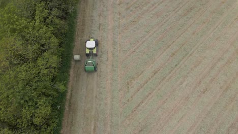 Drone-shot-of-a-tractor-working-in-a-field