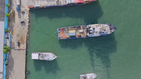Fishing-Boats-And-Barge-Anchored-At-The-Industrial-Port-Of-Puerto-Plata-In-Dominican-Republic