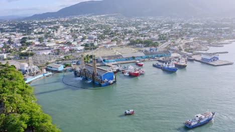 Aerial-pan-reveals-vessels-at-port-of-Puerto-Plata,-Dominican-Republic