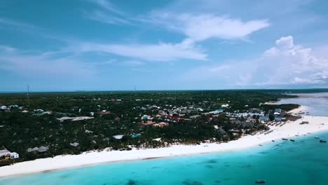Wonderful-aerial-flight-panorama-over-view-drone-shot-over-crystal-clear-turquoise-water-white-sand-beach