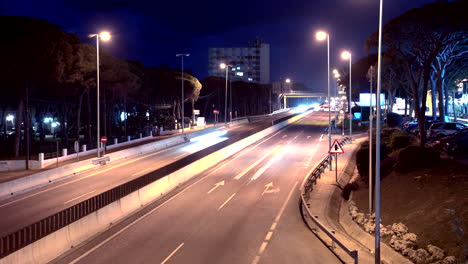 Evening-time-lapse-at-a-busy-road,-slowly-tilting-up