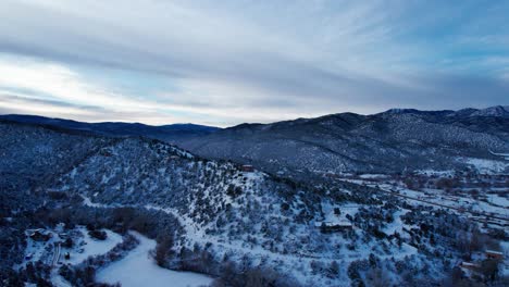 Aerial-drone-shot-over-the-snow-covered-desert-in-New-Mexico
