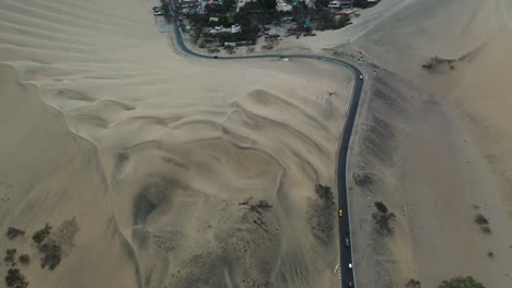 Aerial-Flight-Above-Peru's-Huacachina-Desert-Oasis-Village-in-the-Desert