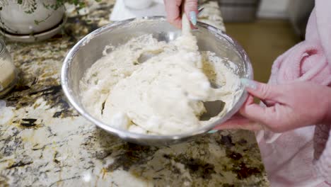 Mixing-beaten-egg-whites-into-raw-dough-to-make-Danish-aebleskivers---AEBLESKIVER-SERIES