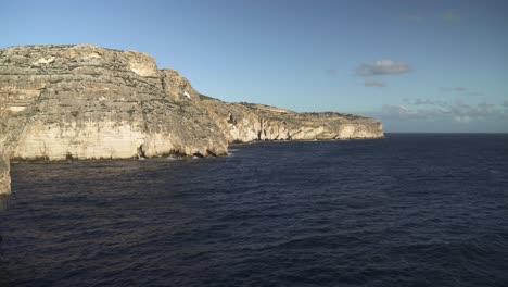 Panoramic-View-of-Blue-Grotto-Sea-Caves-with-Waves-of-Mediterranean-Sea-Crashing-on-Slopes