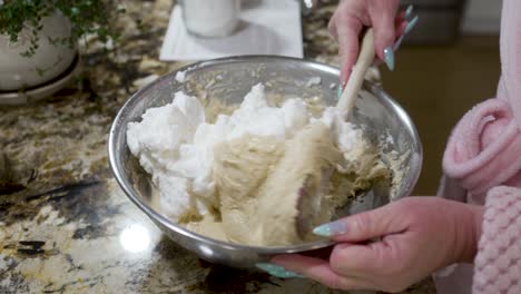 Folding-beaten-egg-whites-into-a-dough-mixture-to-make-Danish-aebleskivers---AEBLESKIVER-SERIES
