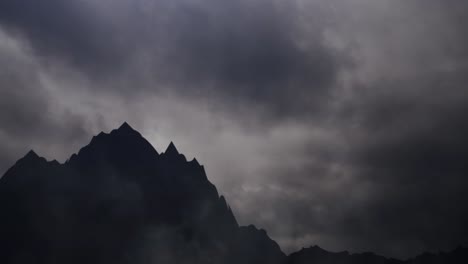 Mountain-silhouette-timelapse-and-dark-cloud-background
