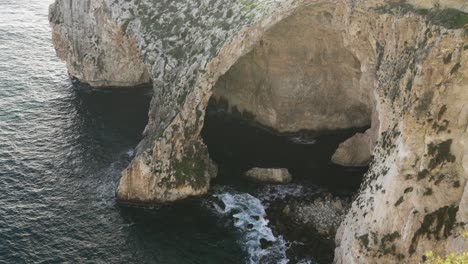 Blue-Grotto-Sea-Caves-Being-Washed-with-Waves-of-Cold-Mediterranean-Sea-Water