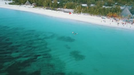 Perfect-aerial-flight-slowly-sinking-down-drone-shot-crystal-clear-turquoise-water
paradise-dream-beach-Zanzibar,-Africa-Tanzania-2019