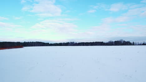 Timelapse-of-snow-covered-field-with-partly-cloudy-skies