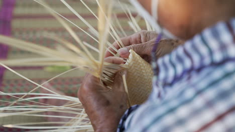 Skillfully-and-Carefully-Weaving-Bamboo-Strips,-Traditional-Bamboo-Weaving-Method
