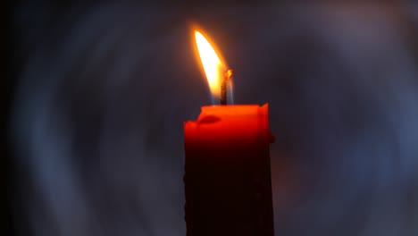 A-red-candle-burning-in-the-dark