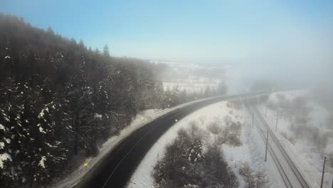 Ukraine-Highway-Road-with-Foggy-Clouds-in-the-WIntertime---Aerial
