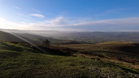 Time-lapse-distant-misty-layers-of-panoramic-rural-mountain-valley-countryside-at-sunrise