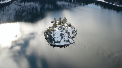 Aerial-of-a-frozen-Fannette-Island-in-Lake-Tahoe-during-record-breaking-snowfall