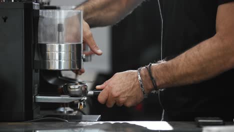 Barista-preparing-the-espresso-lever-to-make-coffee