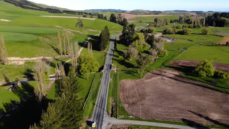 Aerial-view-of-car-driving-in-New-Zealand-countryside