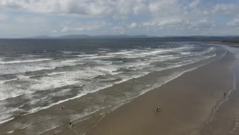 Drone-shot-of-a-surfing-beach-in-Ireland