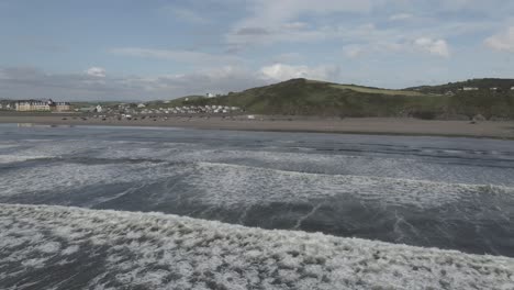 Drone-shot-of-waves-crashing-on-a-beach-in-Ireland
